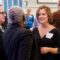 Joyce Ohm smiles chats with supporters at the dinner